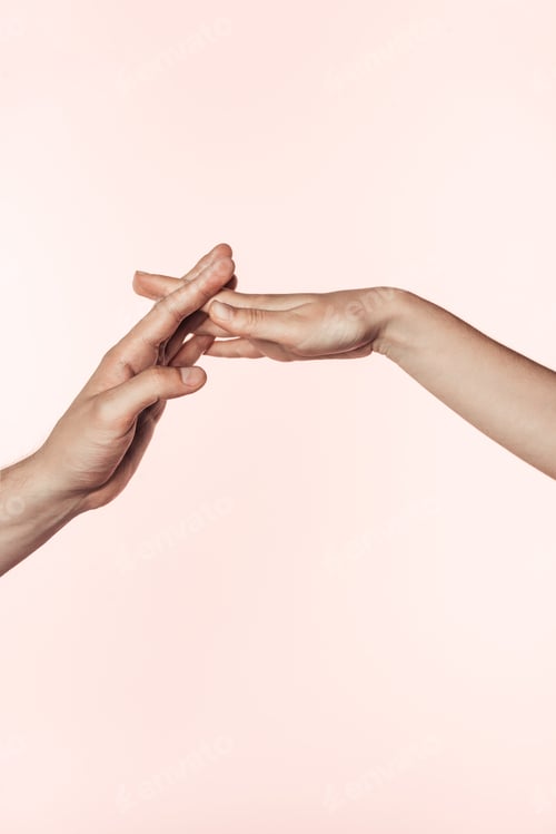 Preview: cropped image of woman and man joining hands isolated on pink background