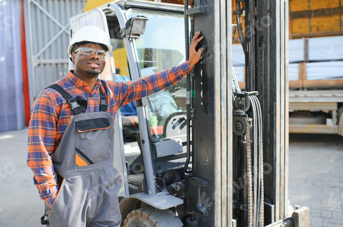 Preview: African logistics man as a forklift driver in the warehouse of a freight forwarder