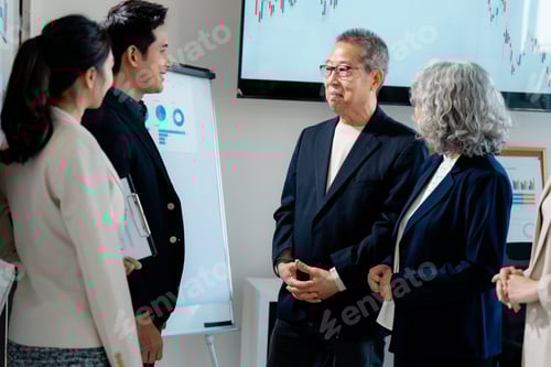 Preview: Business colleagues collaborating in modern workplace setting