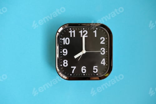 Preview: alarm clock on yellow background.