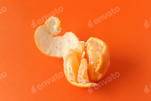 Preview: Peeling orange with orange copy space.