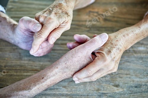 Preview: Senior couple holding hands, close-up