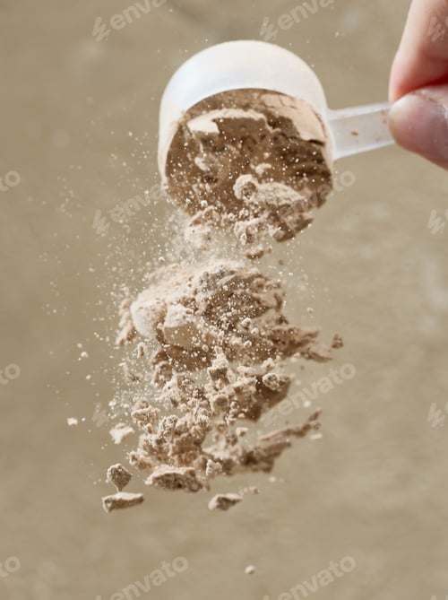 Preview: protein powder spills from measure scoop. whey sports nutrition. dry mixture