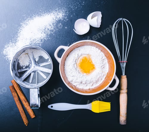 Preview: Ingredients and utensil for baking on the black board, top view