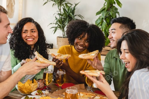 Preview: Group of friends sitting on the floor in living room, drinking beer and eating pizza. House party.