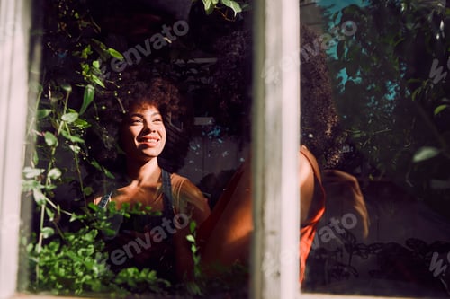 Preview: Black woman, plant store and customer, small business and greenhouse environment in retail flowers