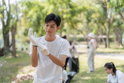 Preview: Young volunteer preparing for a park cleanup, highlighting commitment to environmental