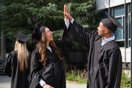 Preview: Graduates Celebrating Success with High Five