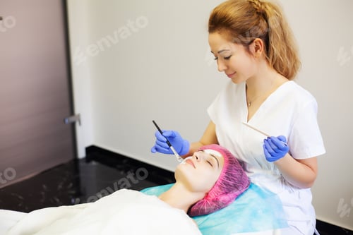 Preview: Spa therapy for young woman having facial mask at beauty salon.