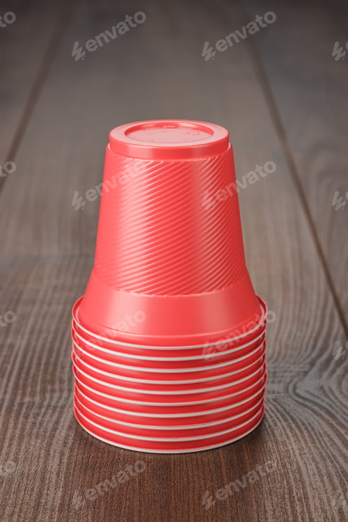 Preview: Stack Of Red Plastic Cups On The Table