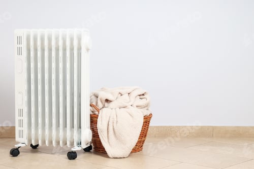 Preview: Concept of heating season, modern electric heater in room