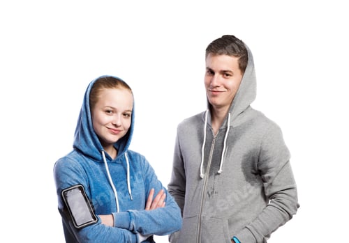 Preview: Teenage boy and girl in sweatshirts. Studio shot, isolated.