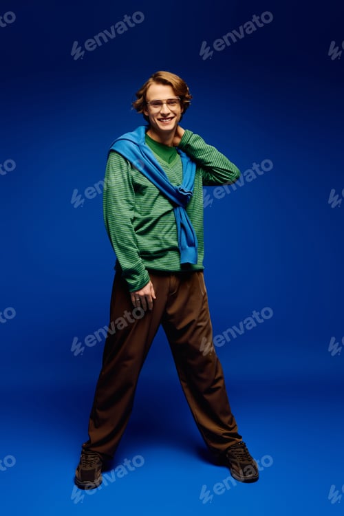 Preview: Fashion forward young man embracing modern youth culture with stylish confidence