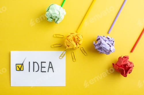 Preview: top view colorful squeezed papers with sticks on yellow background paper college color drawing