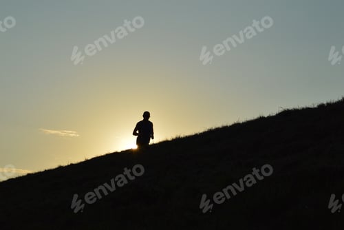 Preview: Man running agains sun at sunset