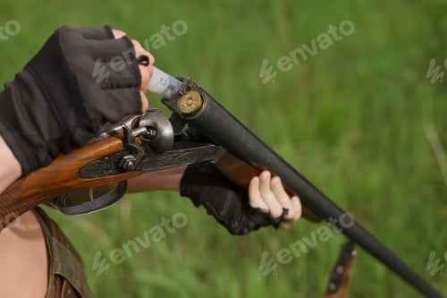 Preview: Process of loading shotshell into hunting double-barreled rifle