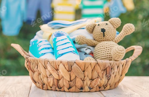 Baby Clothes and Shoes in a Basket