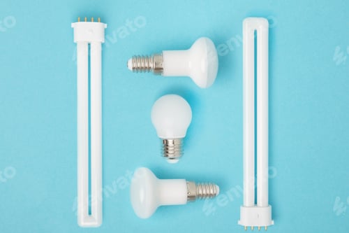 Preview: flat lay with arranged various light bulbs isolated on blue