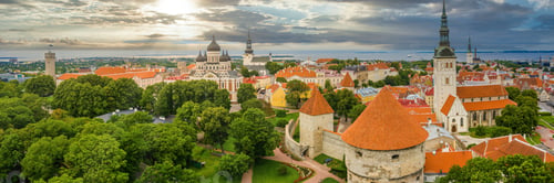 Preview: Panoramic shot of the Tallinn Old Town surrounded by greenery under a cloudy