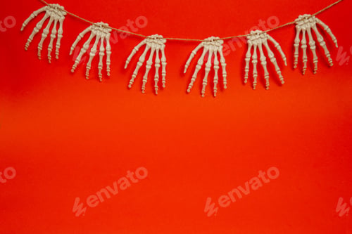 Preview: Halloween red card with skeleton hands, background with copy space. Happy halloween banner mockup