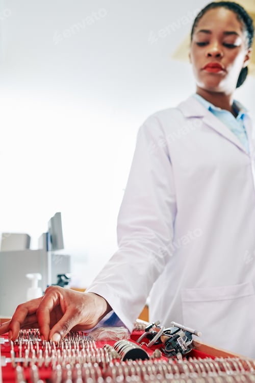 Preview: Optometrist choosing lenses from set