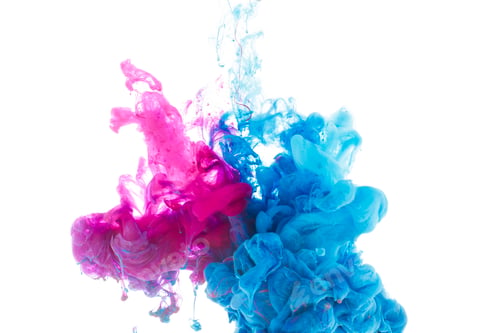 Preview: mixing of blue and pink paint splashes isolated on white