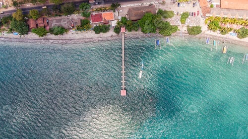 Preview: Top view jetty with janggolan boat on turquoise coastline