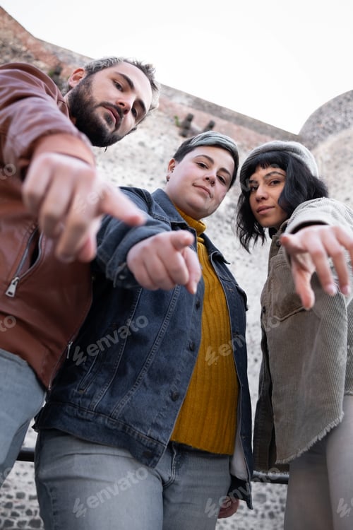 Preview: Youth Trio Pointing and Staring Intensely at Camera