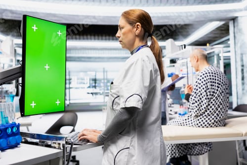 Preview: Chroma key in vertical position next to nurse observing new drug testing