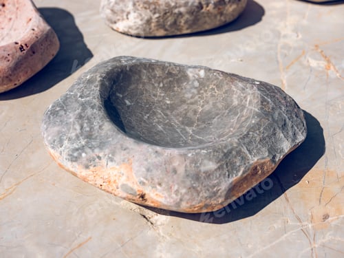Preview: Decorative stone bowl on gray surface