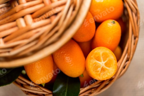 Preview: Kumquat or cumquat on wooden table