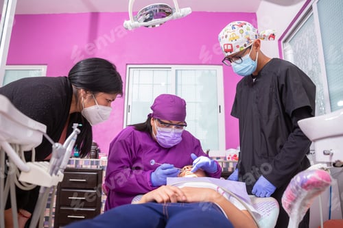 Preview: Mexican female dentist explaining the dental problems the young girl has to her mother