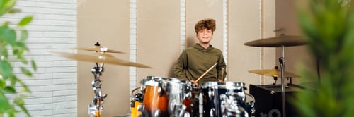 Preview: Young Drummer in Studio with Copy Space Wide Banner