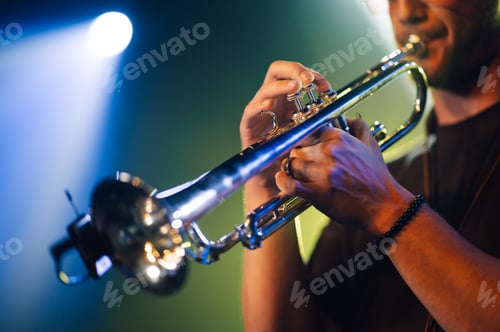 Preview: Musician playing trumpet on stage during music concert