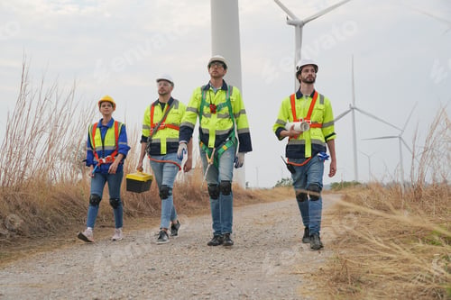 Preview: Sustainable energy industry - Engineers working at alternative renewable wind energy farm