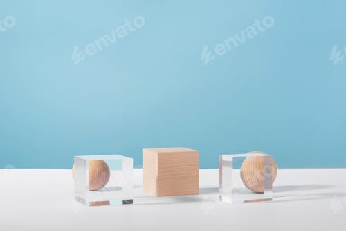 Preview: Wooden and glass cube podium and wooden sphere on blue background for product advertising, front