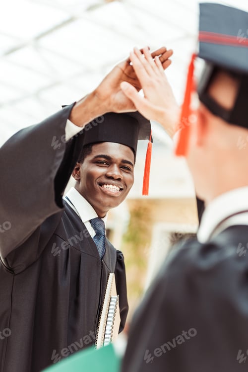 Preview: close-up shot of happy multiethnic students giving high five