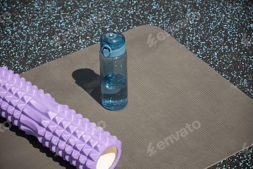 Preview: Foam Roller and Water Bottle on Yoga Mat