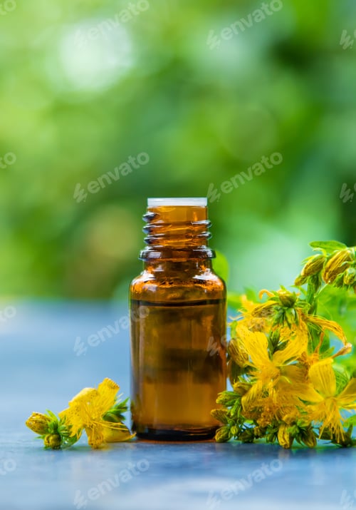 Preview: An essential oil extract of St. John's wort herb. Selective focus.