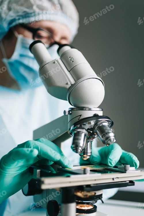 Preview: Scientist working in laboratory with microscope