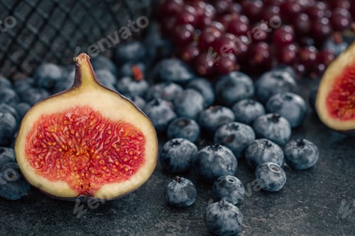 Preview: Close-up, figs in the cut among the berries.