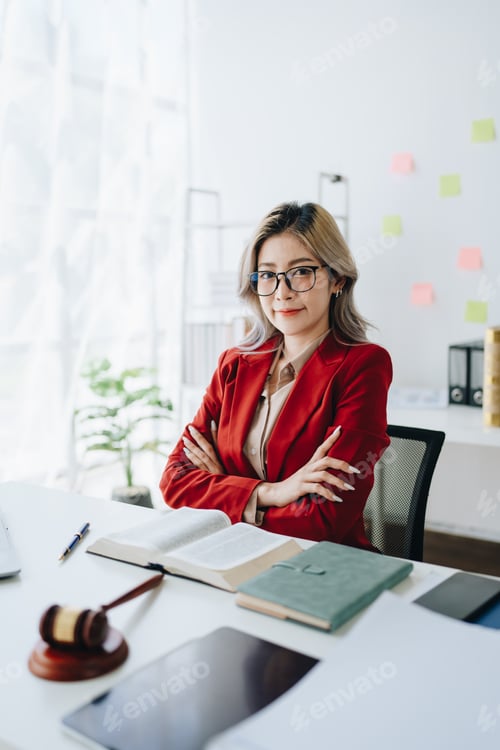 Preview: Portrait of a Asian woman lawyer studying a lawsuit for a client before going to court