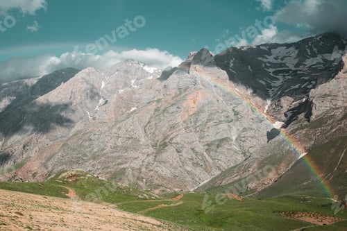 Preview: Cloudy peak from Turkish mountains with rainbow.