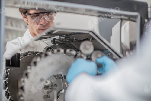 Preview: Scientist adjusting equipment in a laboratory