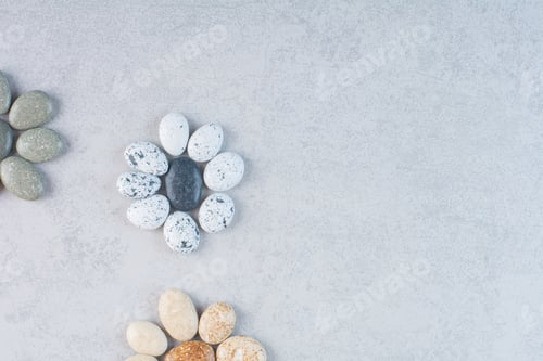 Preview: Colorful decorative stones for crafting on concrete background