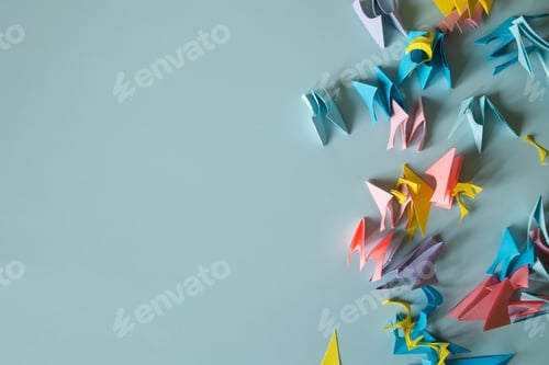 Preview: scraps of colored paper on a blue background top view.