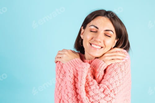 Preview: Woman Embracing Self with Closed Eyes Smiling