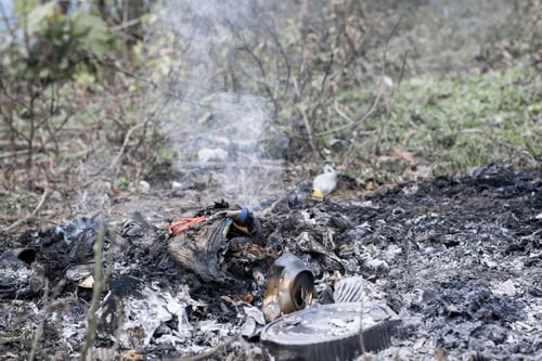 Preview: Environmental pollution (polución), mixture of domestic waste being burned in the open air on a farm