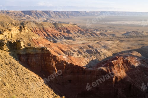 Preview: Colorful desert canyons under a clear sky