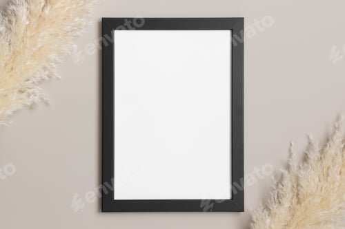 Preview: Top view of a black frame mockup with pampas decoration.